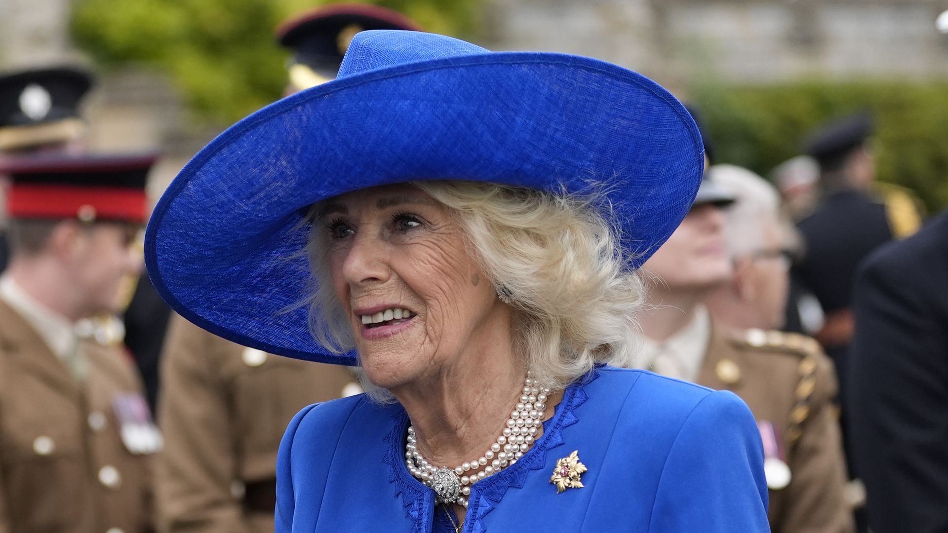 Queen Camilla meets military personal after a Beating Retreat military ceremony at Windsor Castle, Berkshire, on day two of the president's second state visit to the UK on September 17, 2025 in Windsor, England.