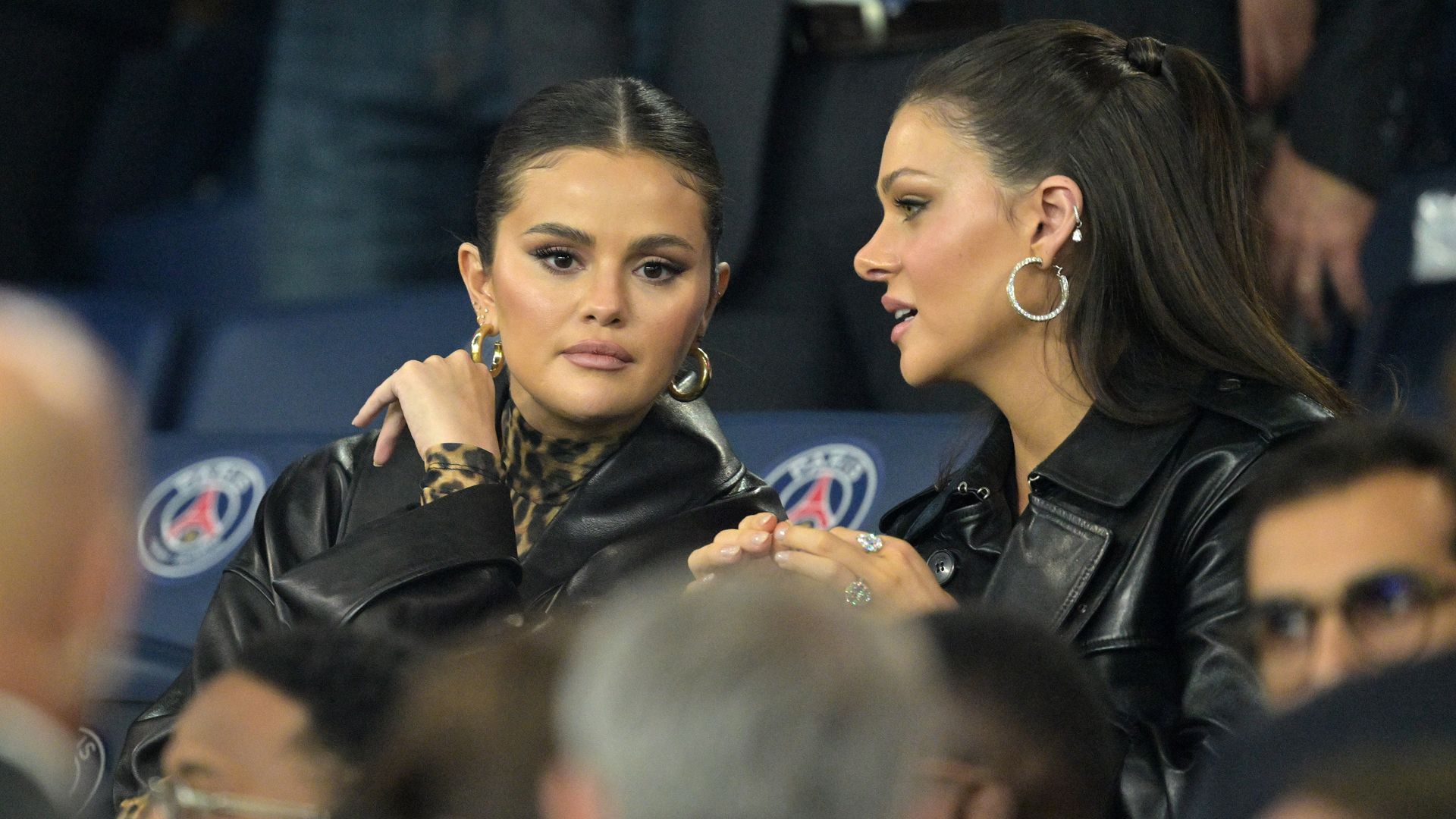 Selena Gomez and Nicola Peltz wearing chunky hoop earrings 