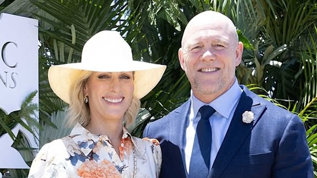 Zara Tindall wears a white gown decorated with orange florals, as her husband Mike Tindall wears cream chinos and a blue blazer