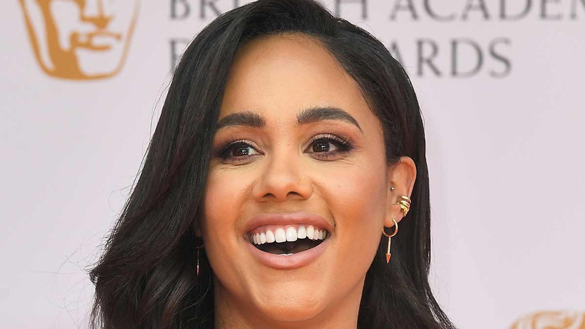 Alex Scott Flashes Toned Abs In Risqué Pvc Corset And Matching Trousers 