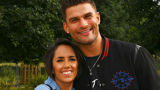 Janette Manrara in a denim dress and Aljaz Skorjanec in a bomber jacket