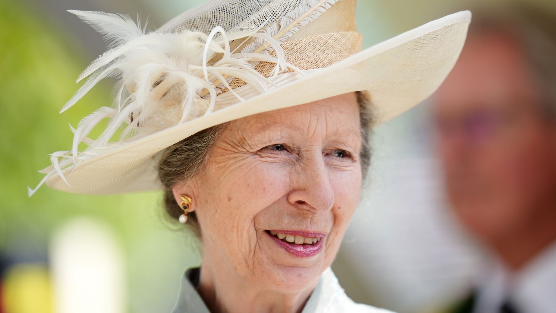 The Princess Royal smile for photo wearing smart dress and hat ahead of a trophy presentation following the St James's Palace Stakes during day one of Royal Ascot