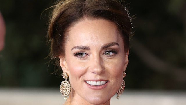 Kate Middleton wearing gold dress and earrings