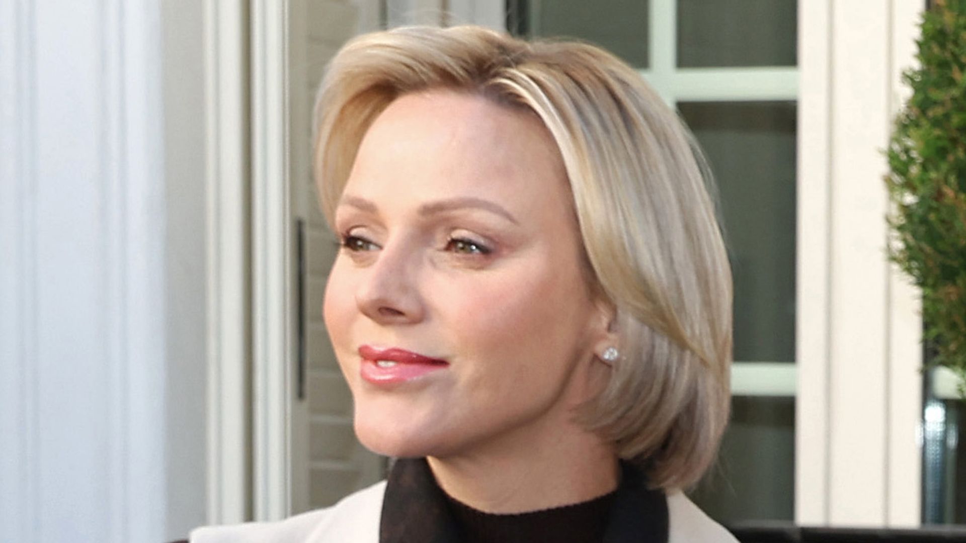 Princess Charlene's balletic updo conceals long hair transformation