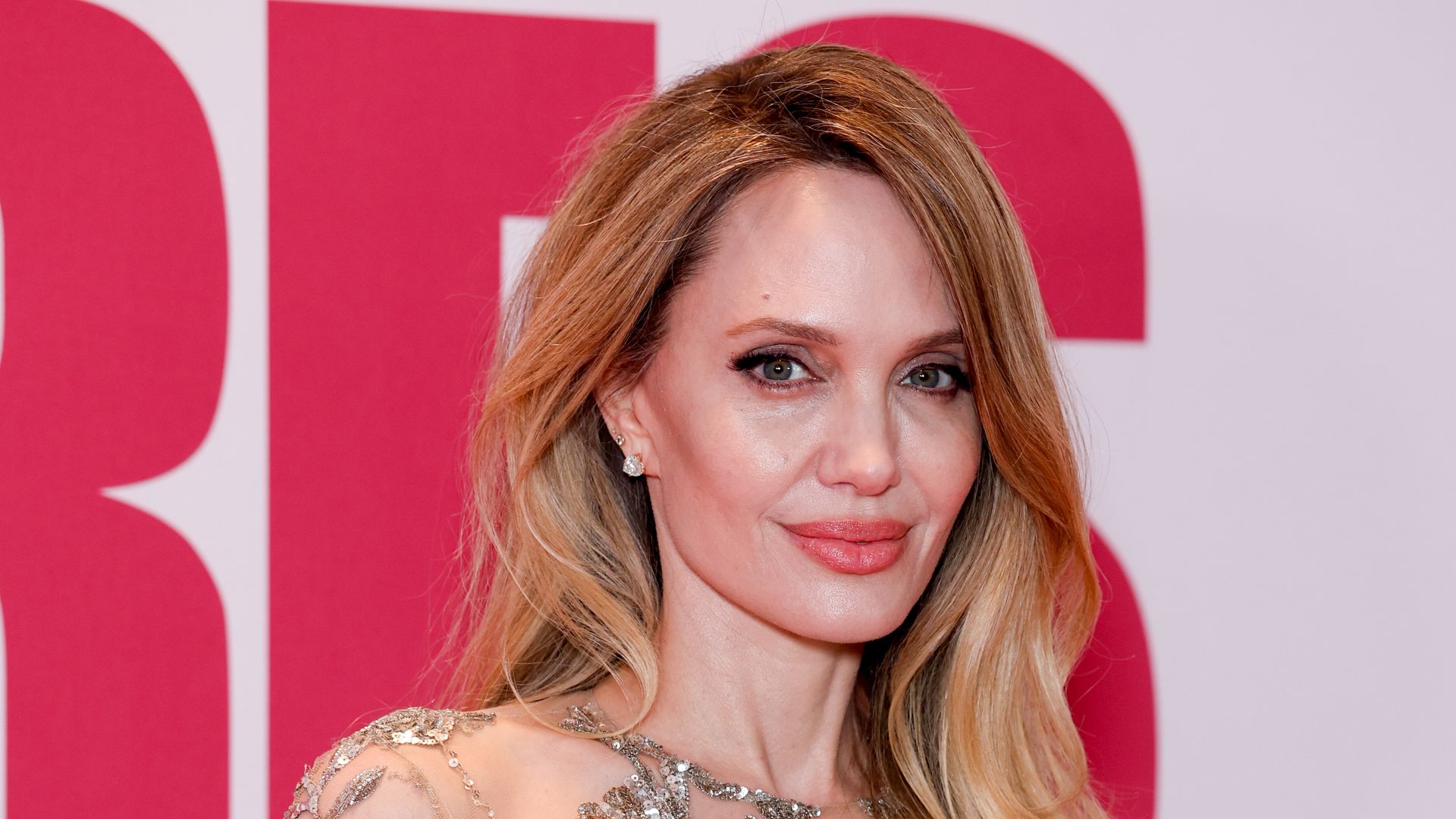 Angelina Jolie makes powerful red carpet statement with daring 'naked' dress