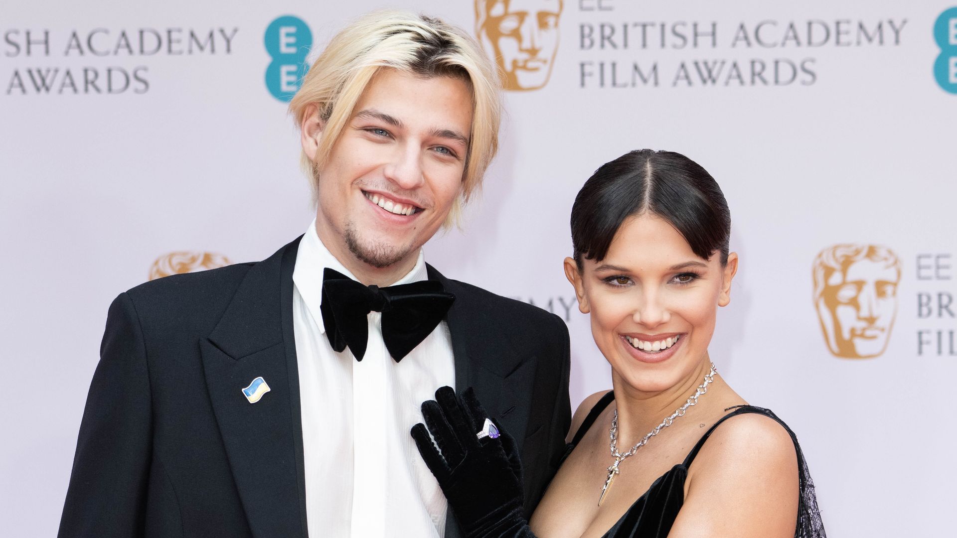 ake Bongiovi  and Millie Bobby Brown attend the EE British Academy Film Awards 2022 at Royal Albert Hall on March 13, 2022 in London, England.