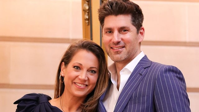 Ginger Zee in a blue one shouldered dress with her husband Ben Aaron