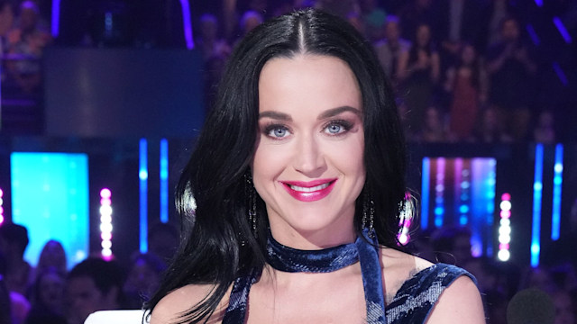 Katy Perry smiling in a denim outfit on American Idol