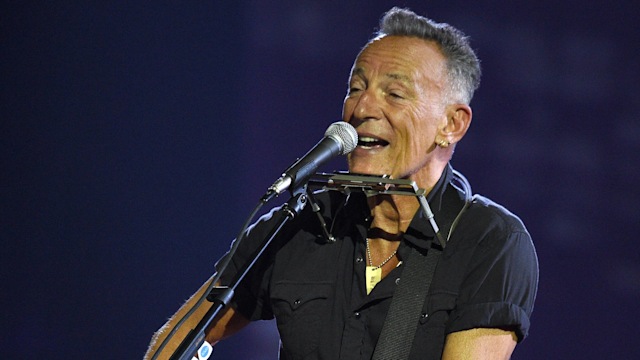 Bruce Springsteen playing a guitar