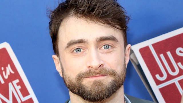 photo of daniel radcliffe smiling at just in time broadway opening