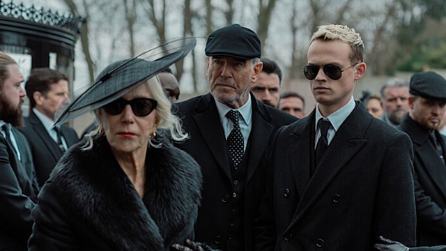 Three people dressed in black