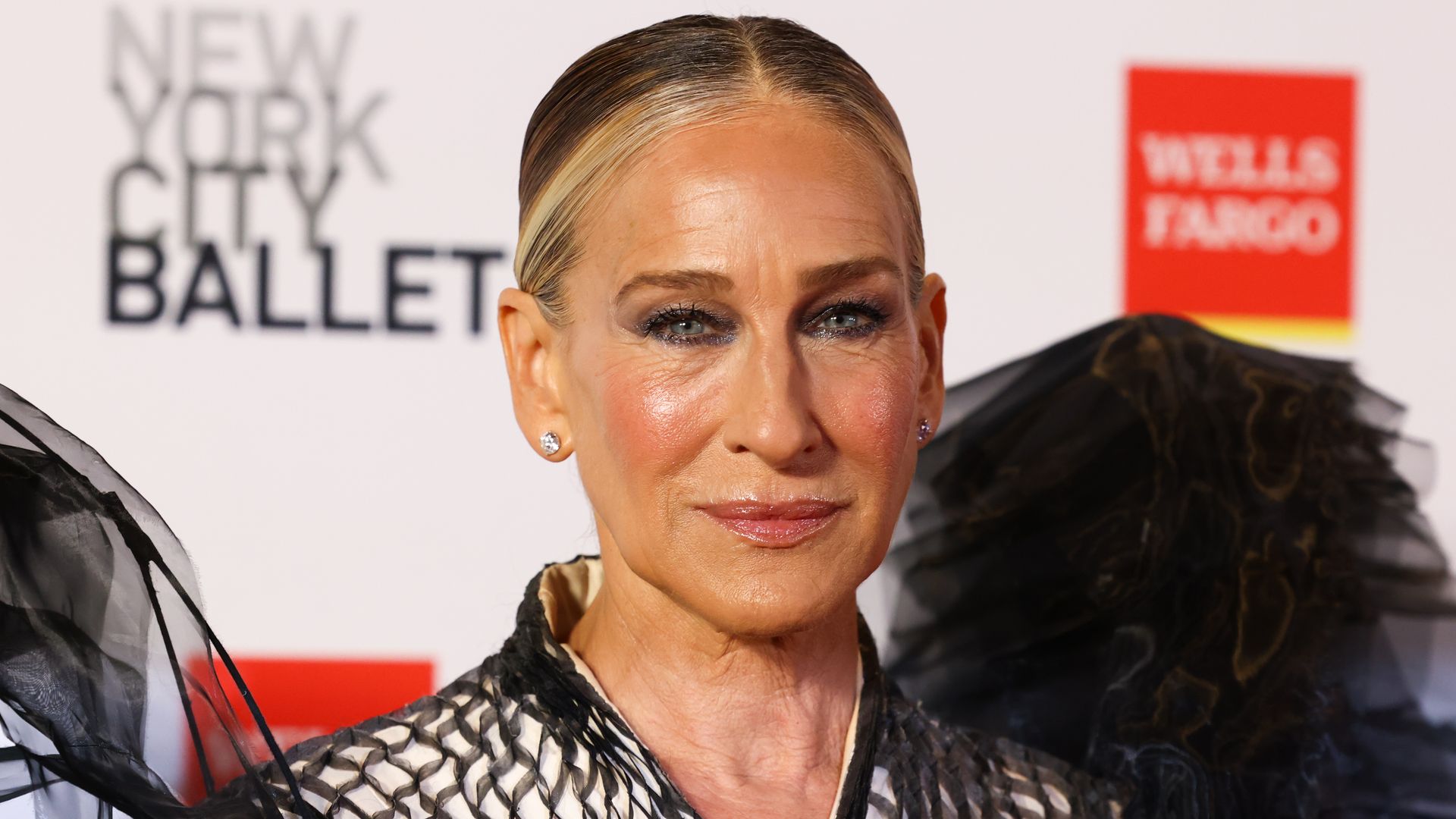 Sarah Jessica Parker clsoe up in black gown with hair slicked back
