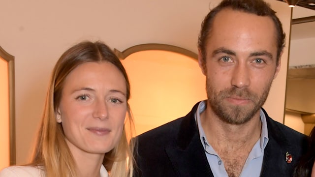 Alizee Middleton in a white suit with her husband James Middleton in a blue shirt and black jacket