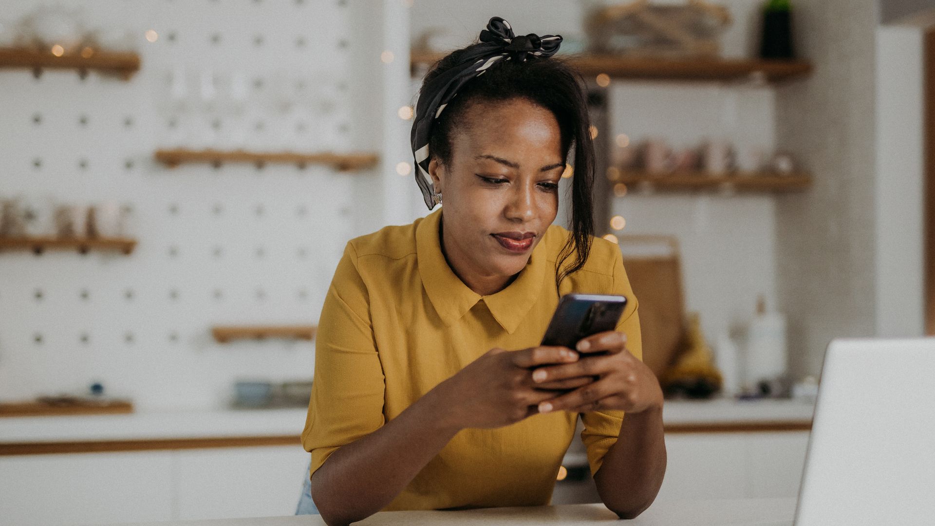 Young woman using her smartphone at home