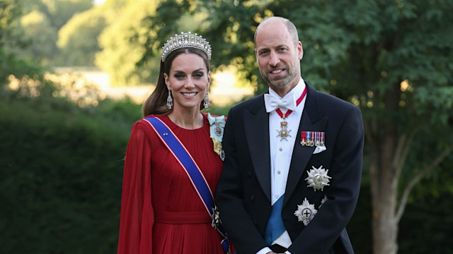 Kate in red caped gown and William in white tie ahead of French state banquet