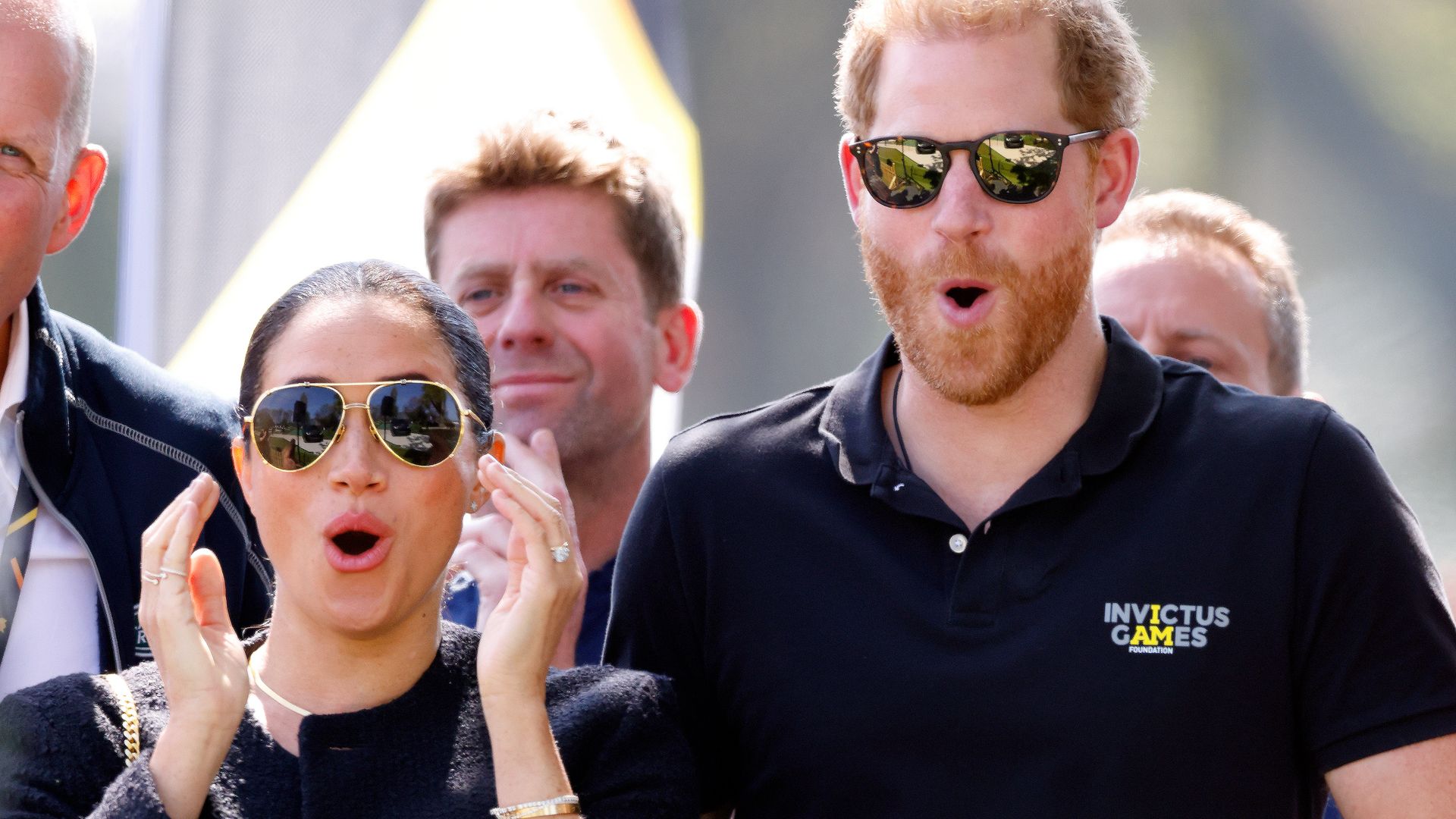 prince harry and meghan markle looking shocked