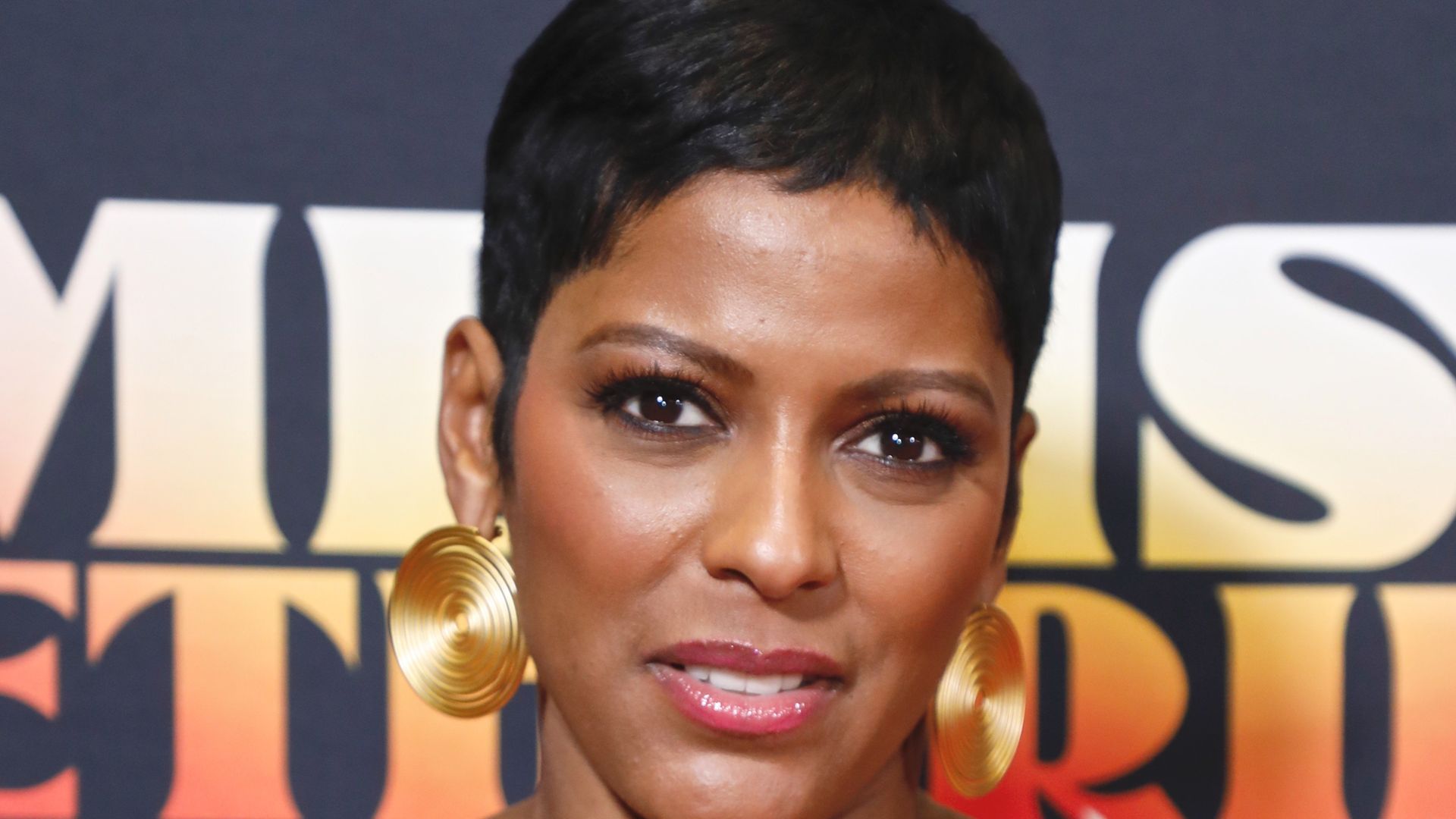 Tamron Hall in a black dress