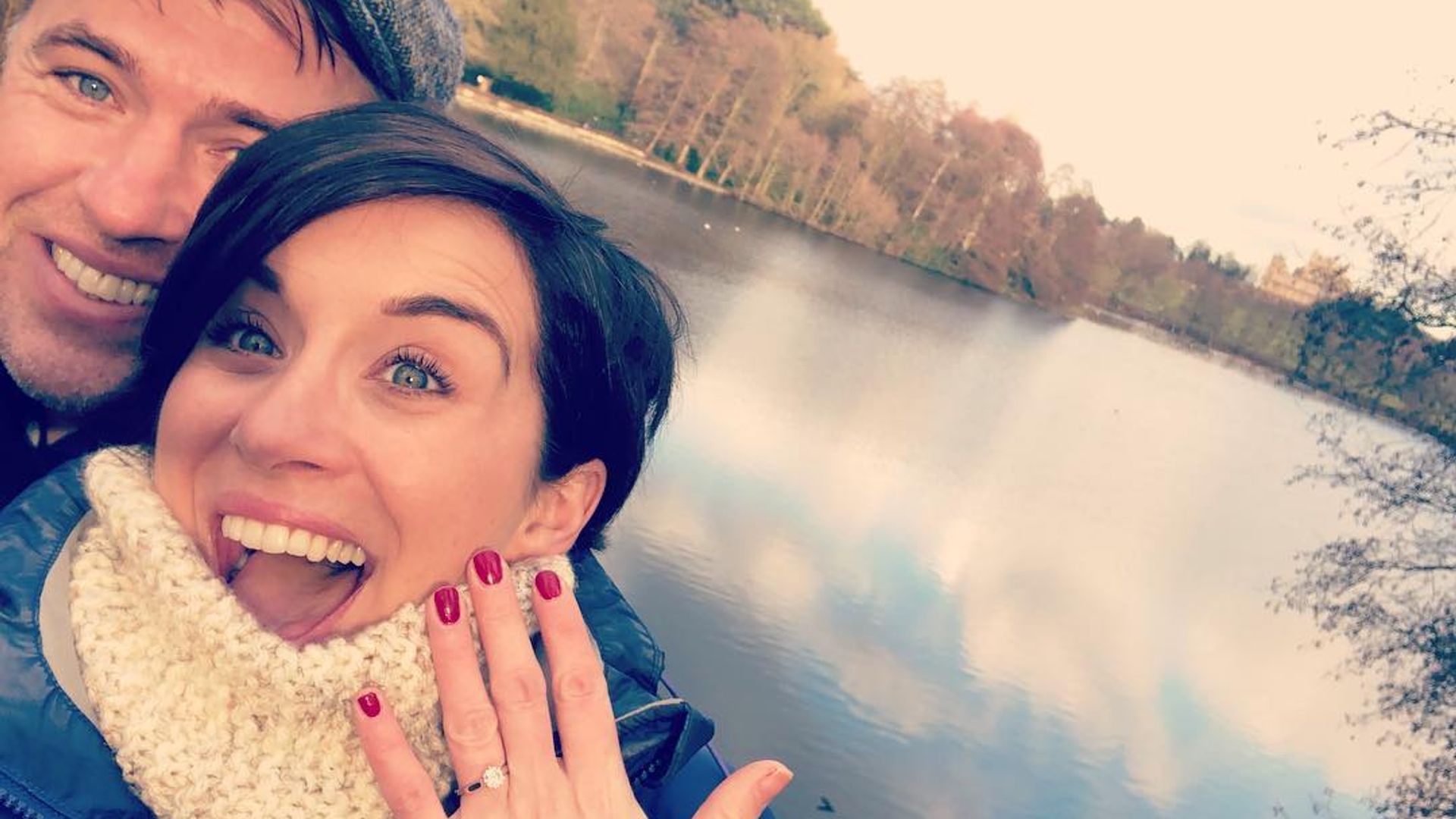 Vicky McClure showing off her engagement ring in front of a lake