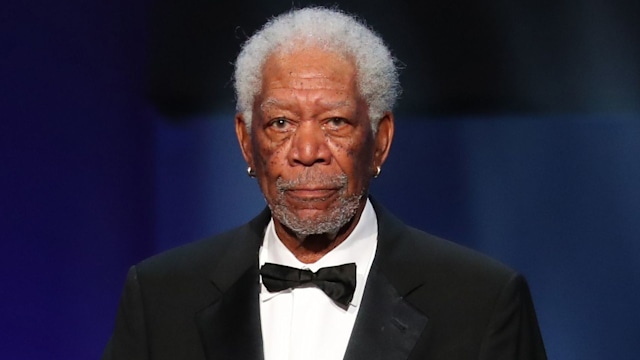 Morgan Freeman standing at a plinth