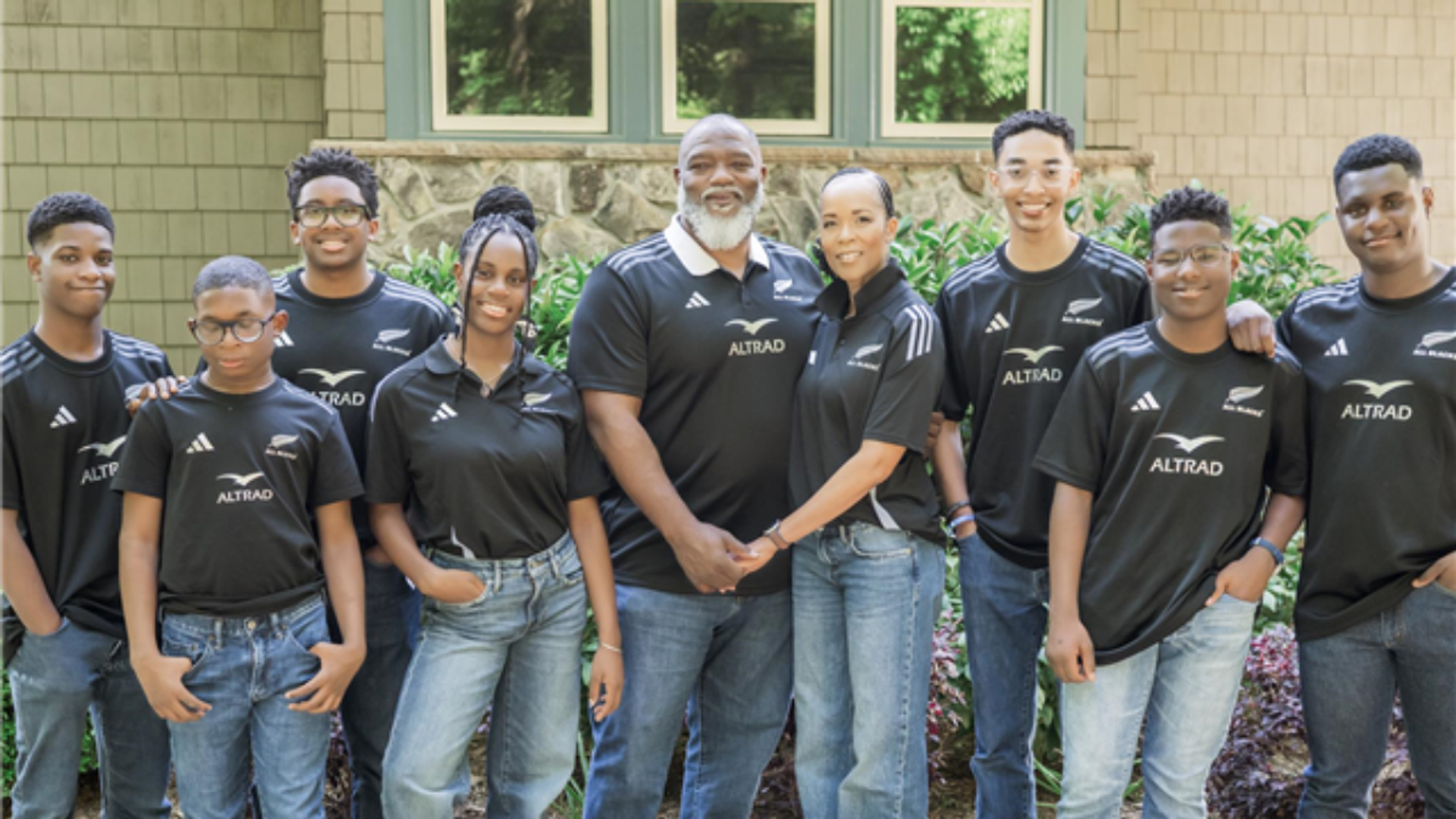 Voddie Baucham Jr (5L) with his wife Bridget to his right, and his seven adopted children