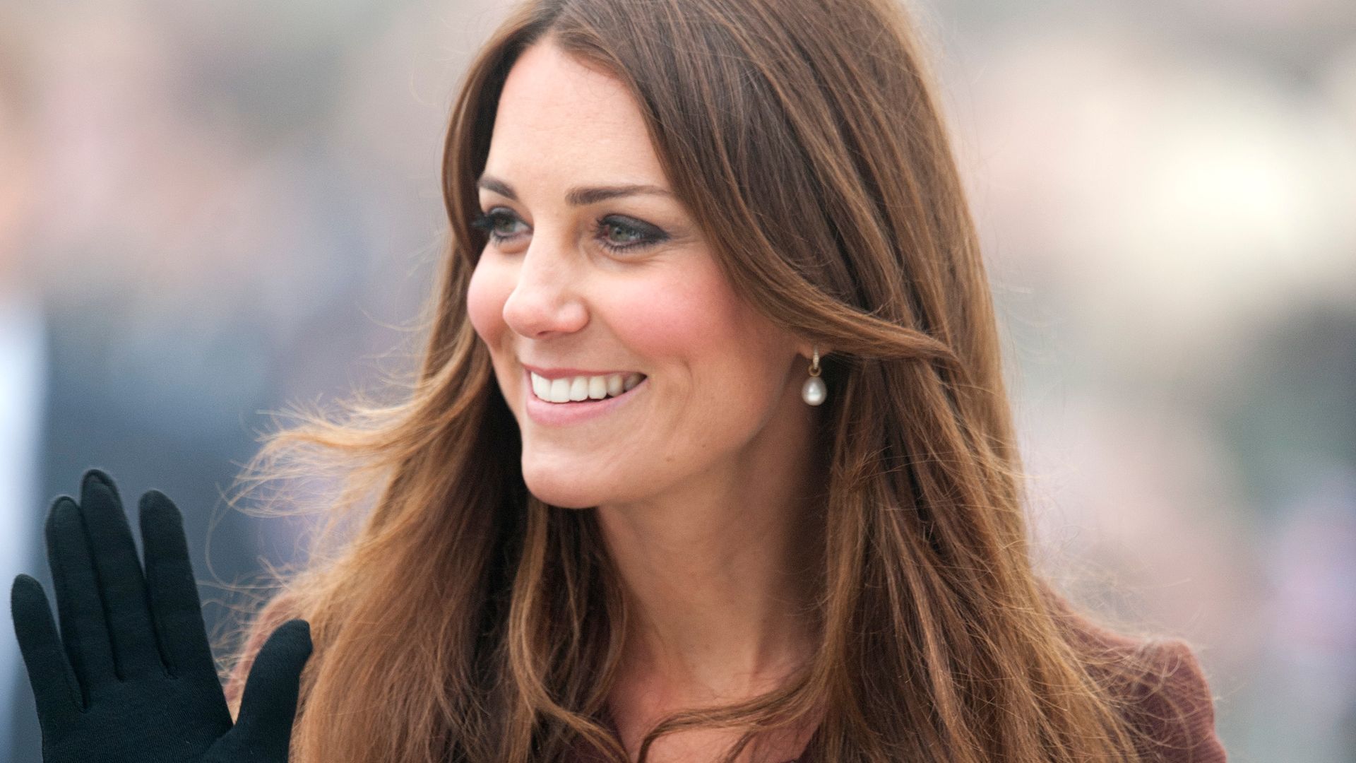 Kate Middleton wearing a brown coat during her official visit to Grimsby on March 5, 2013 in Grimsby, England. 