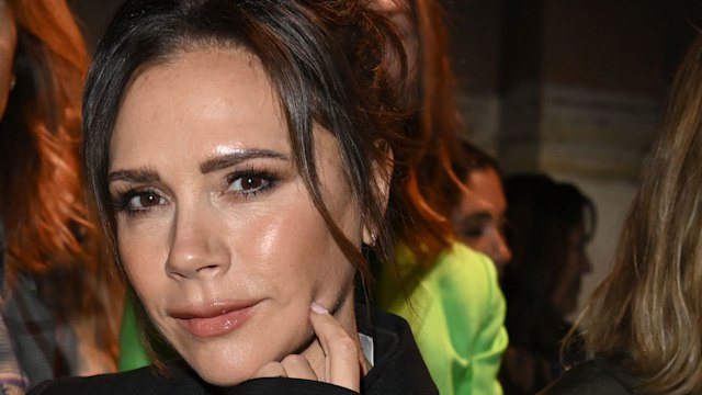 Victoria Beckham sports glowy skin and an effortless nude lip whilst attending LFW