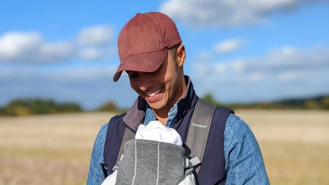 Repair Shop star Will Kirk holding baby in sling 