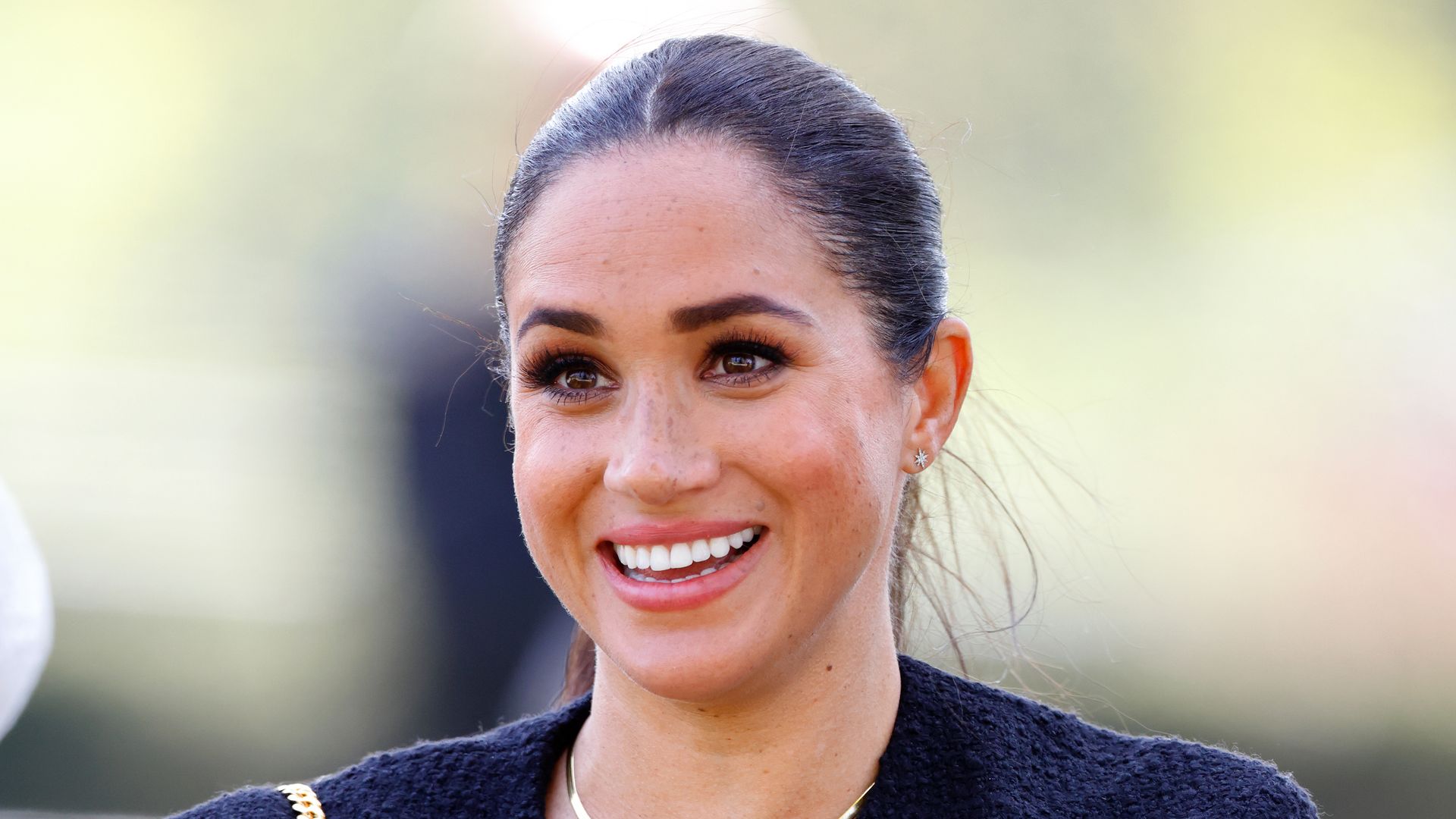 Meghan Markl wearing blazer and gold necklace at Invictus Games