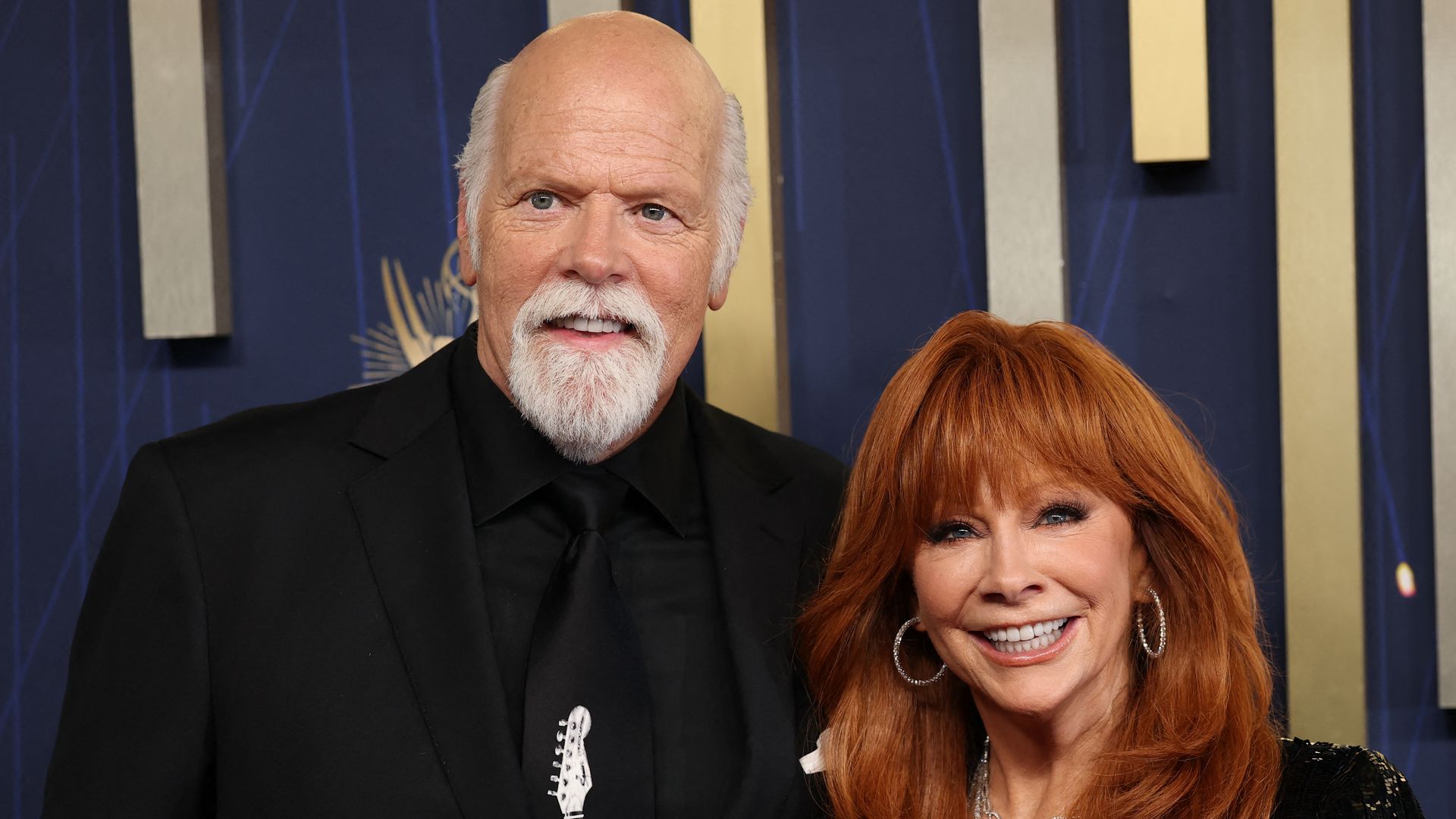 US actors Reba McEntire and Rex Linn arrive for the 77th Primetime Emmy Awards at the Peacock Theatre at LA Live in Los Angeles on September 14, 2025