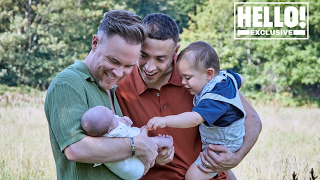 Stuart and Francis lovingly dote on their newborn child