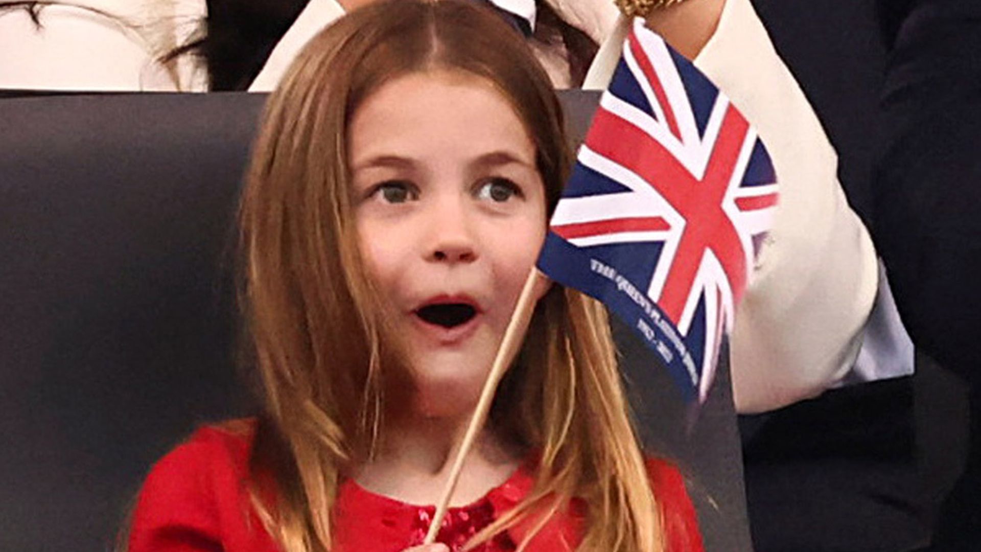 princess charlotte waving flag during platinum jubilee concert
