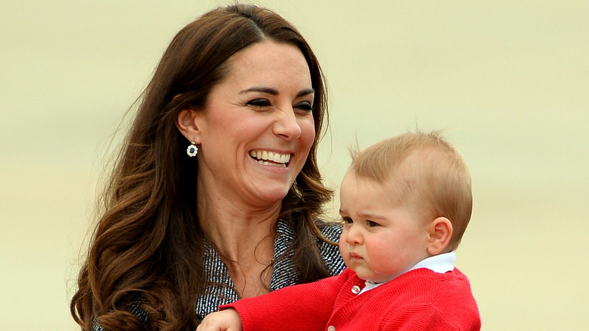 Kate Middleton with her son Prince George at the Defence Establishment Fairbairn in Canberra on April 25, 2014. 