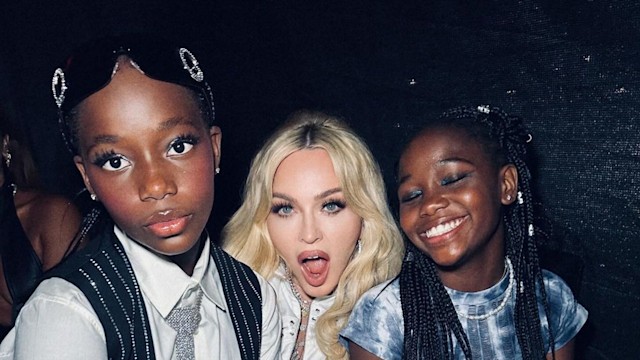 Madonna poses with her twin daughters Stella and Estere for a photo for her set at LadyLand 2024