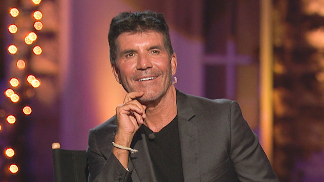 Simon Cowell sitting on a producer chair during AGT 