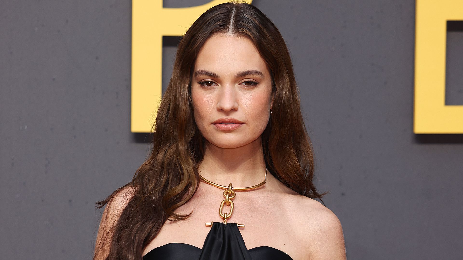 Lily James carries the nightwear-as-outerwear trend into 2026 in lace slip dress