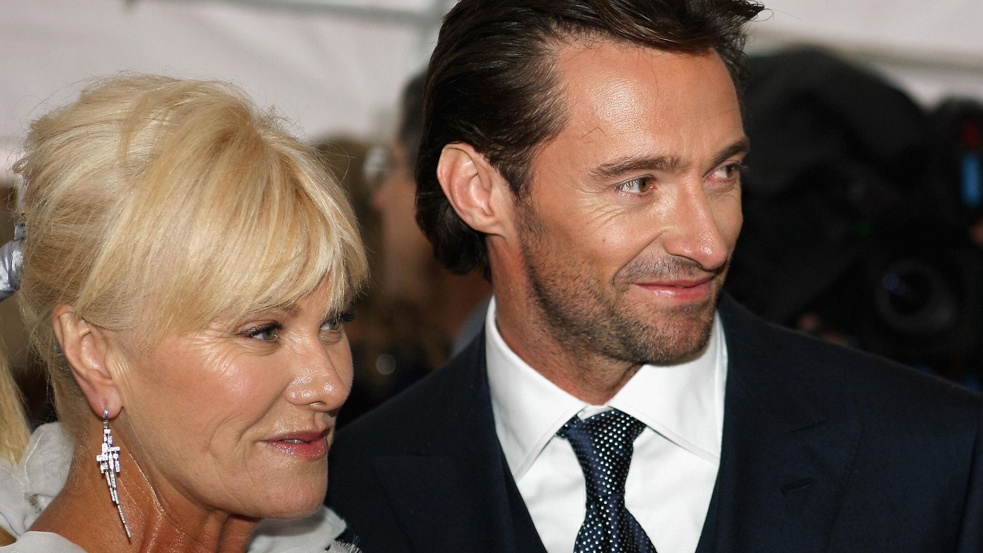 Hugh Jackman in a suit and his wife Deborah-Lee Furness in white at the premier of Australia in 2008