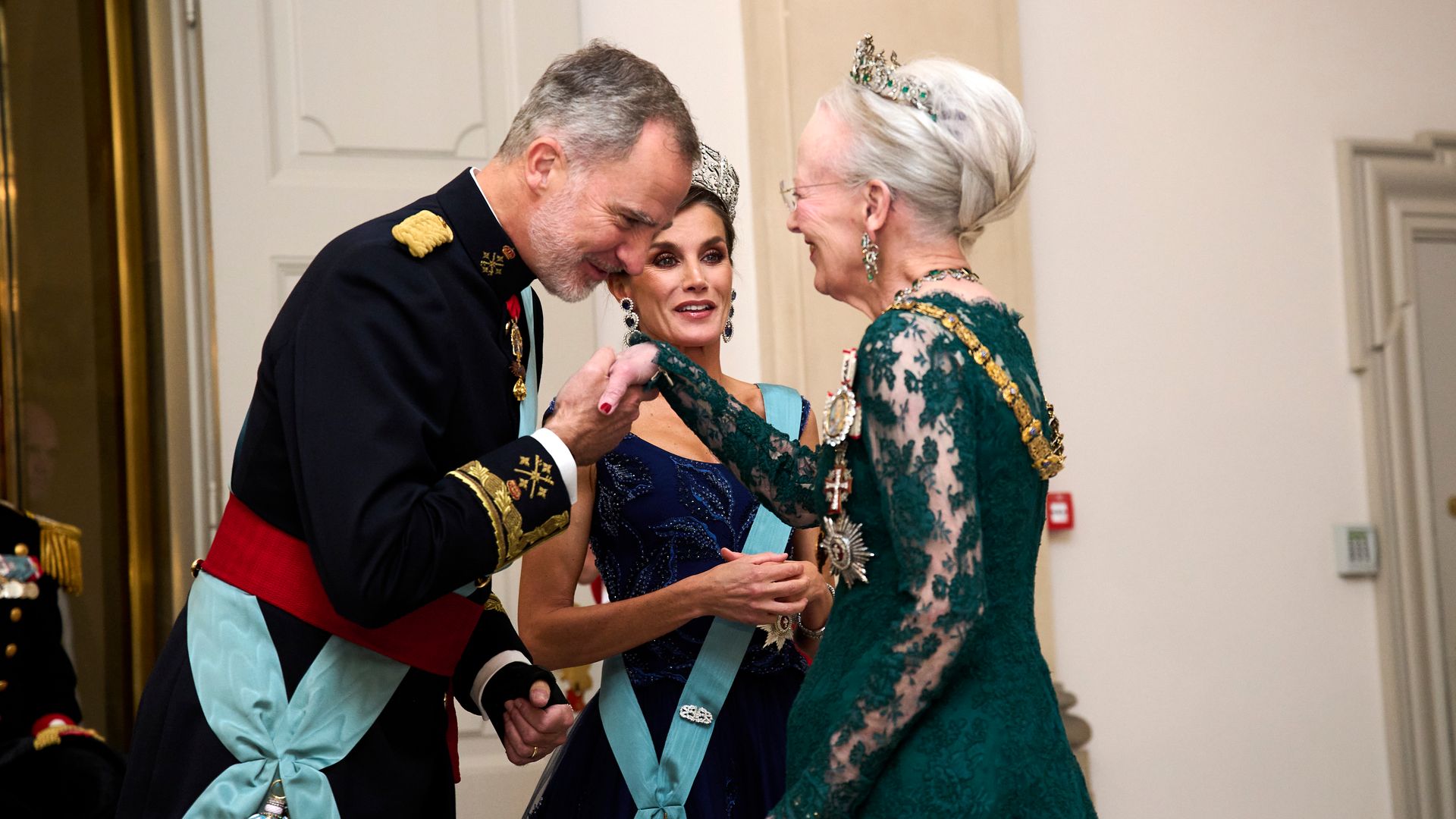 Queen Margrethe of Denmark also dazzled in a dark green gown, seen here greeting King Felipe and Queen Letizia