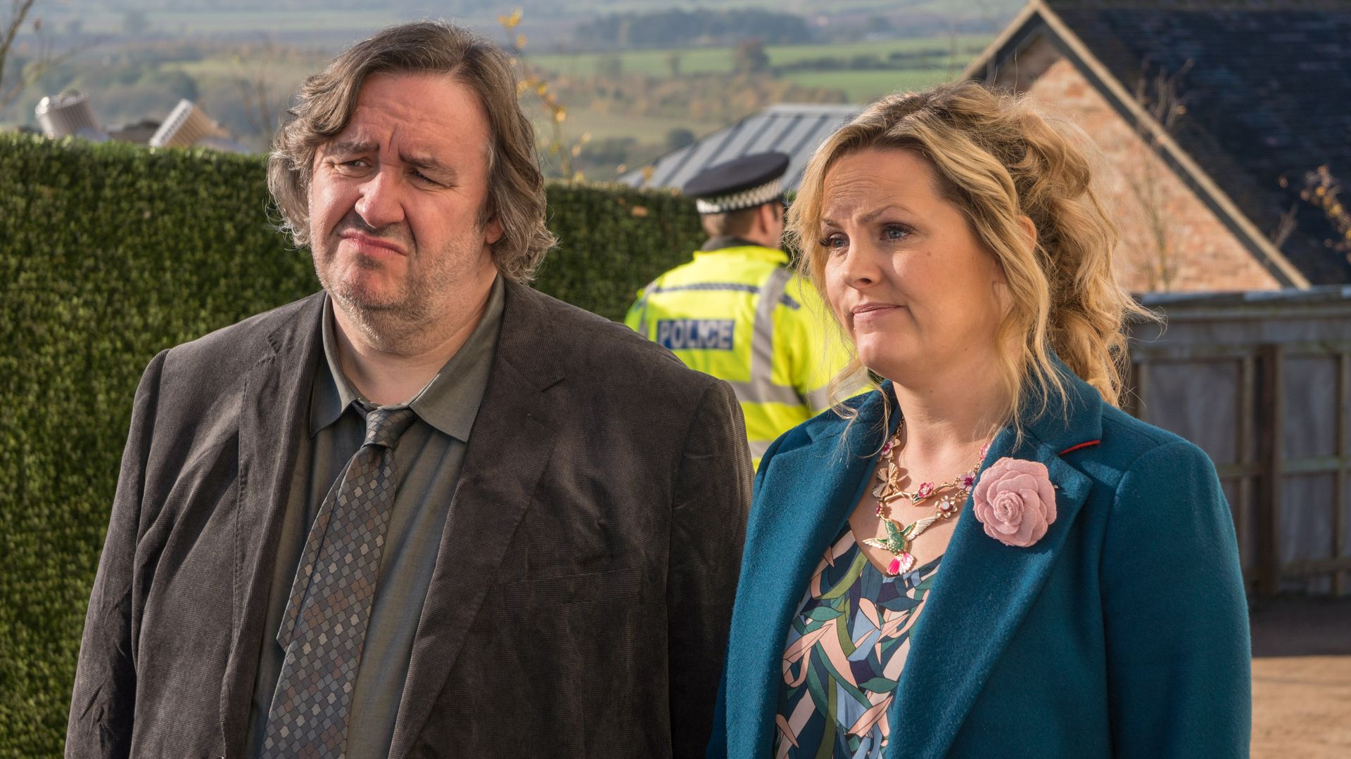 man and woman standing outdoors