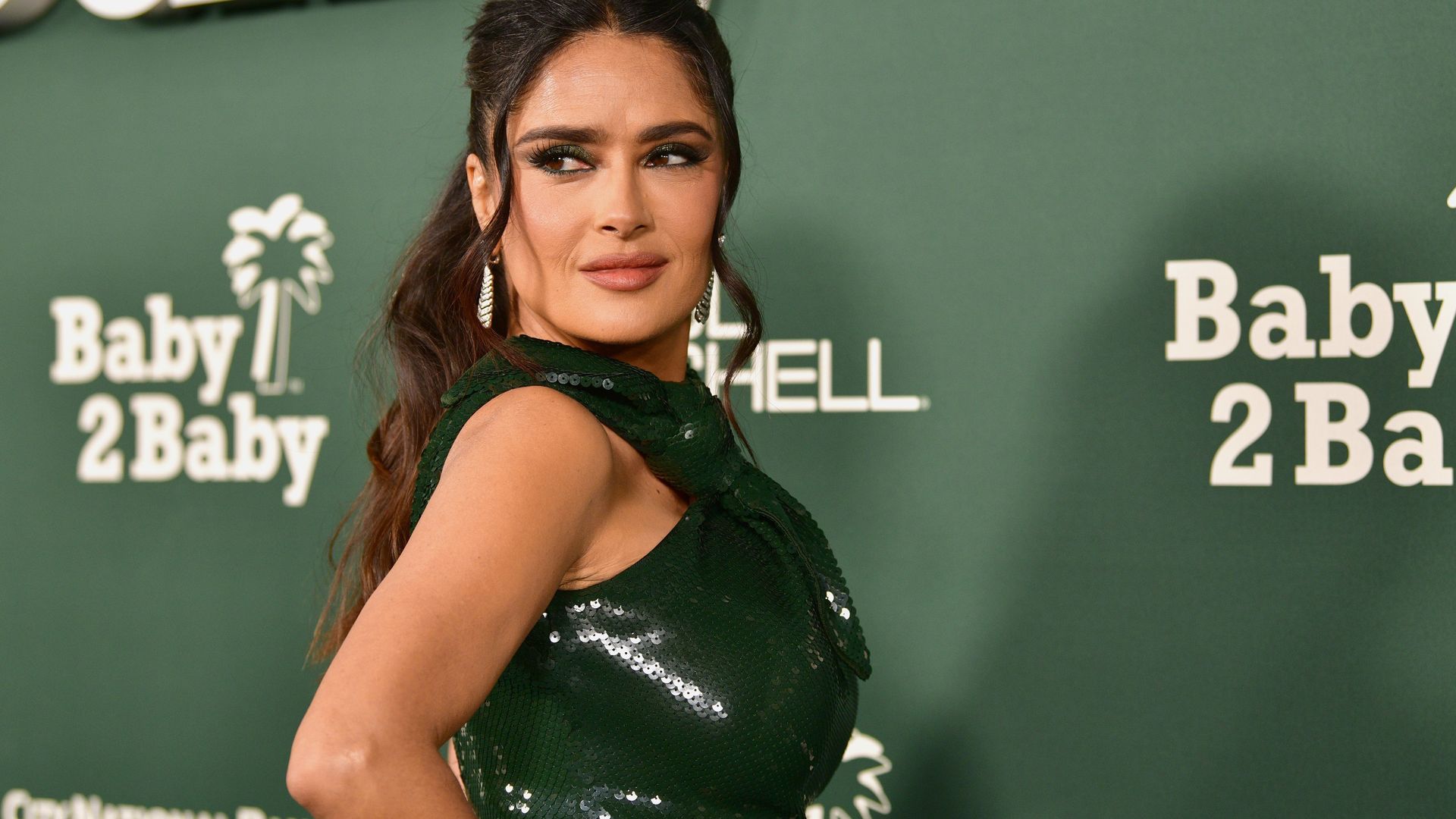 Salma Hayek, 57, is a goddess in slinky green gown at star-studded gala