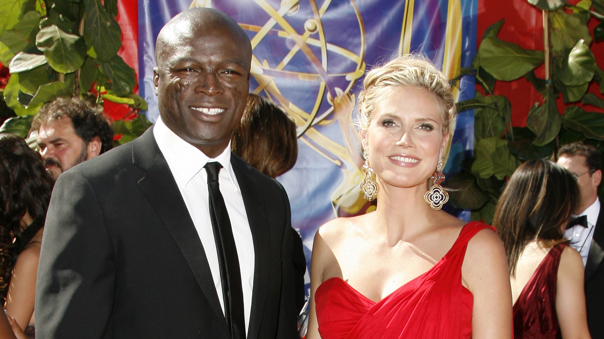 Seal and Heidi Klum smiling together on the Emmys red carpet