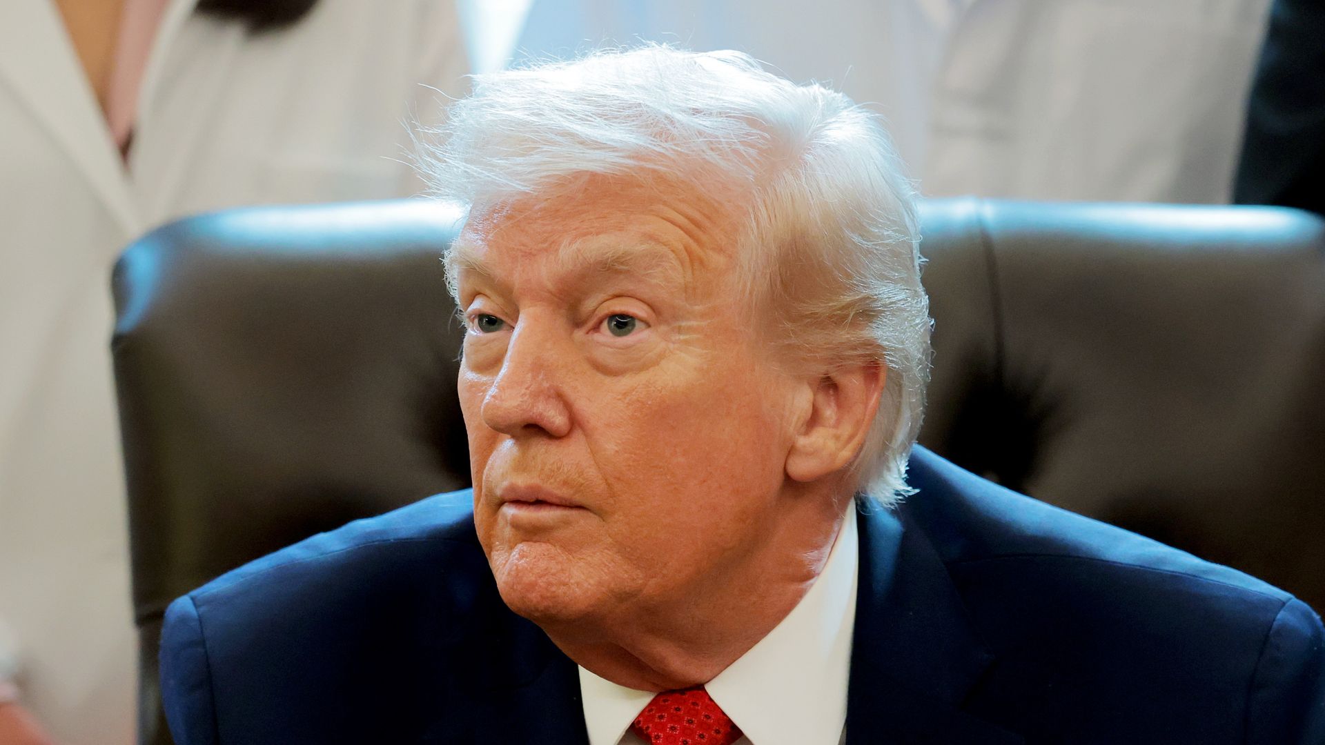 donald trump sitting at desk