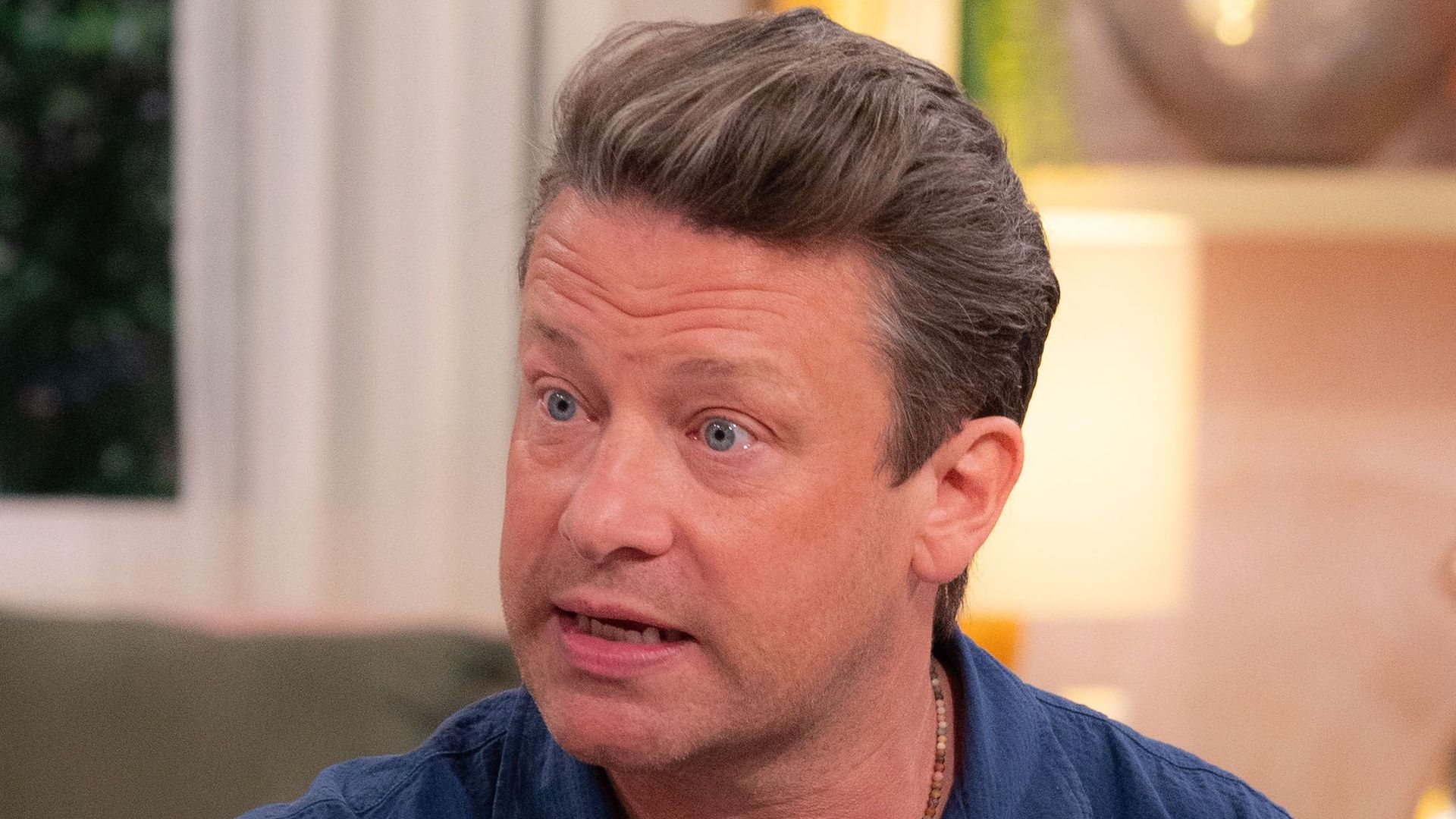 Jamie Oliver on This Morning sofa in blue shirt