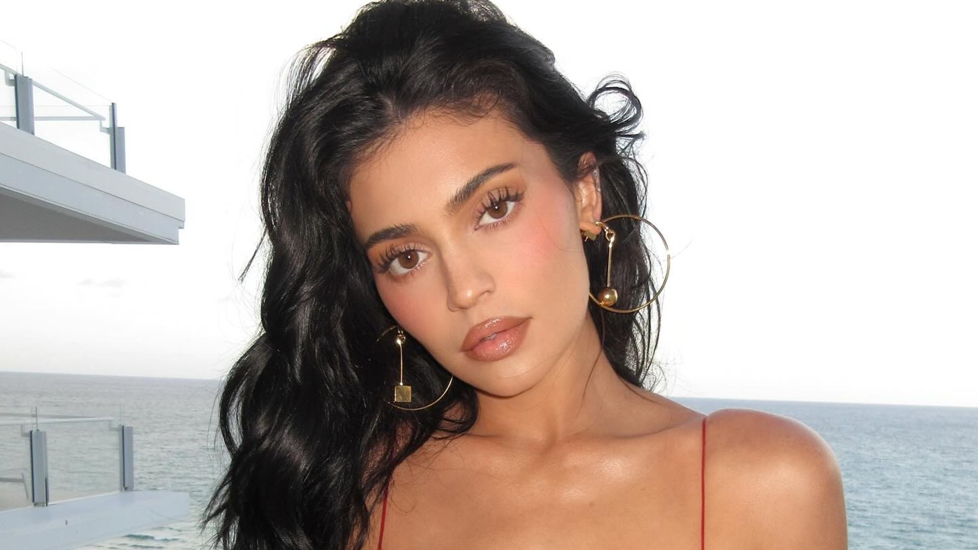 Kylie Jenner poses in a red mini dress on her Instagram