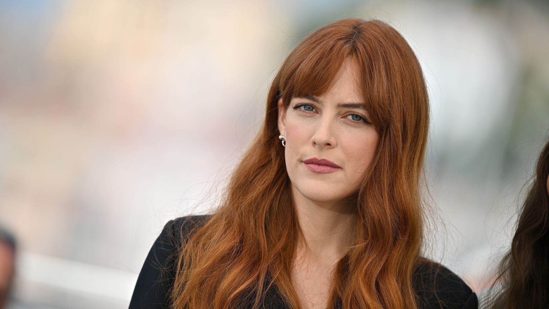 Riley Keough attends the photocall for "War Pony" during the 75th annual Cannes film festival at Palais des Festivals on May 21, 2022 in Cannes, France