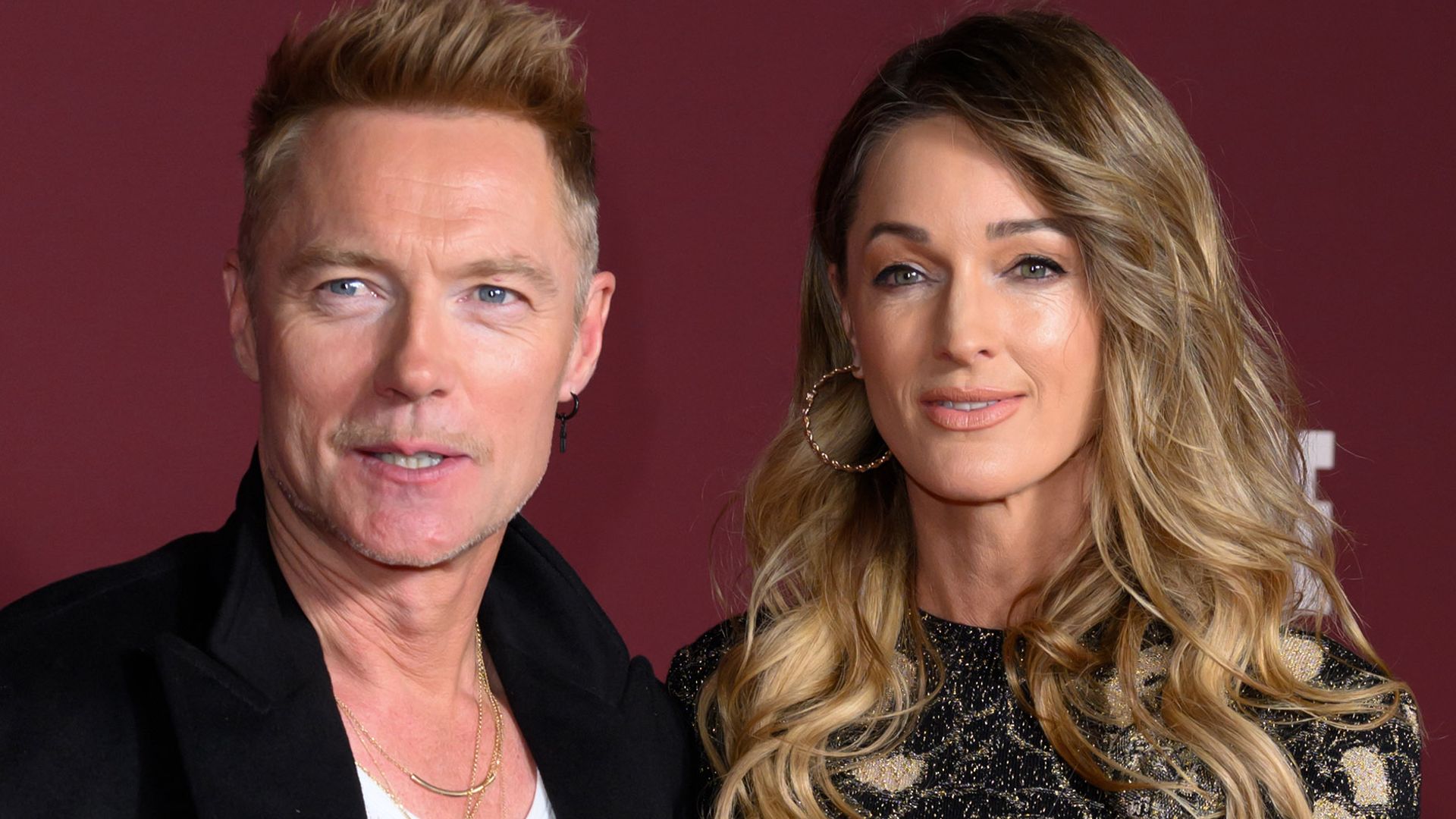 Storm Keating looking straight-faced alongside Ronan on the red carpet