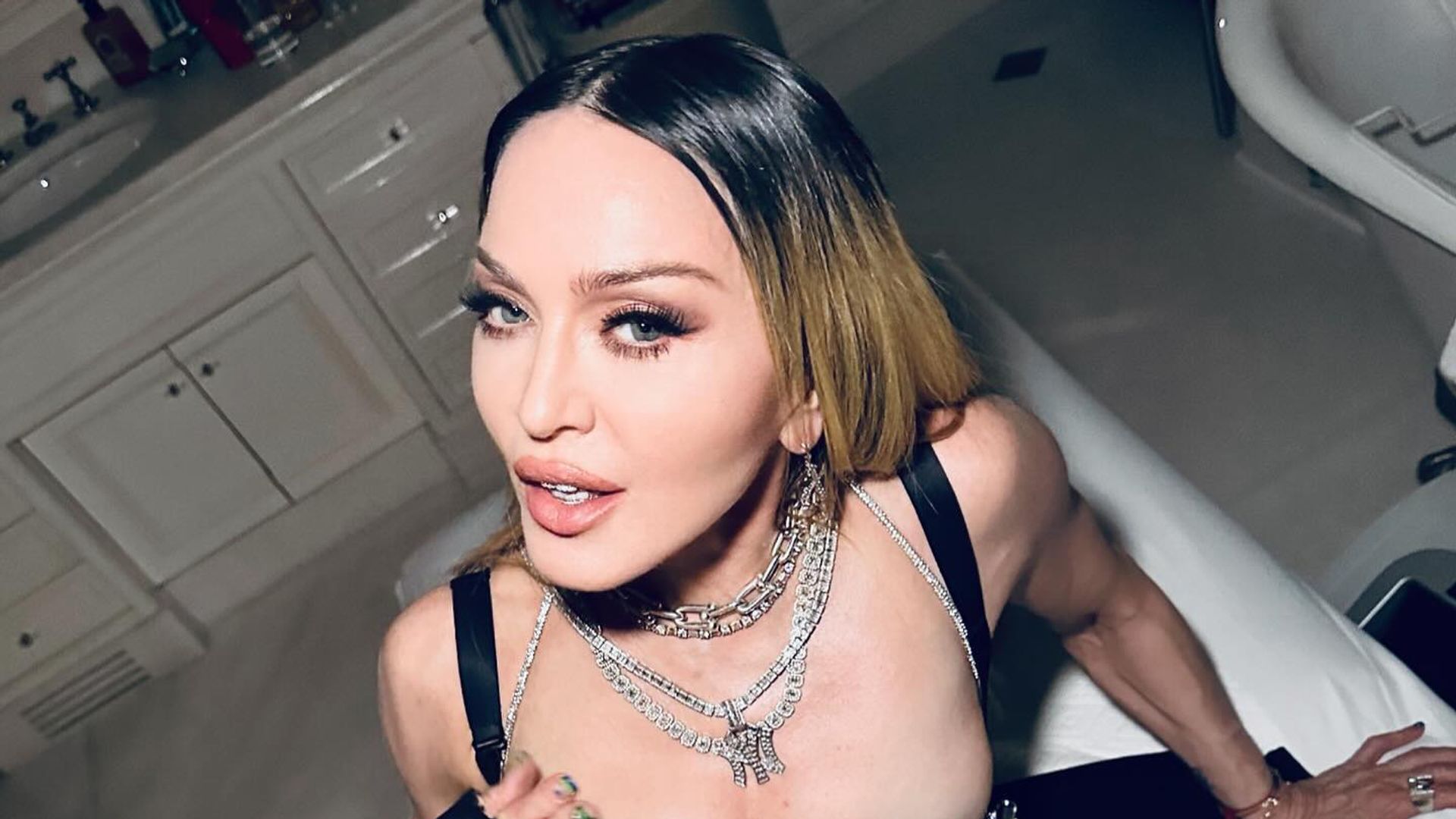madonna sitting in bathroom