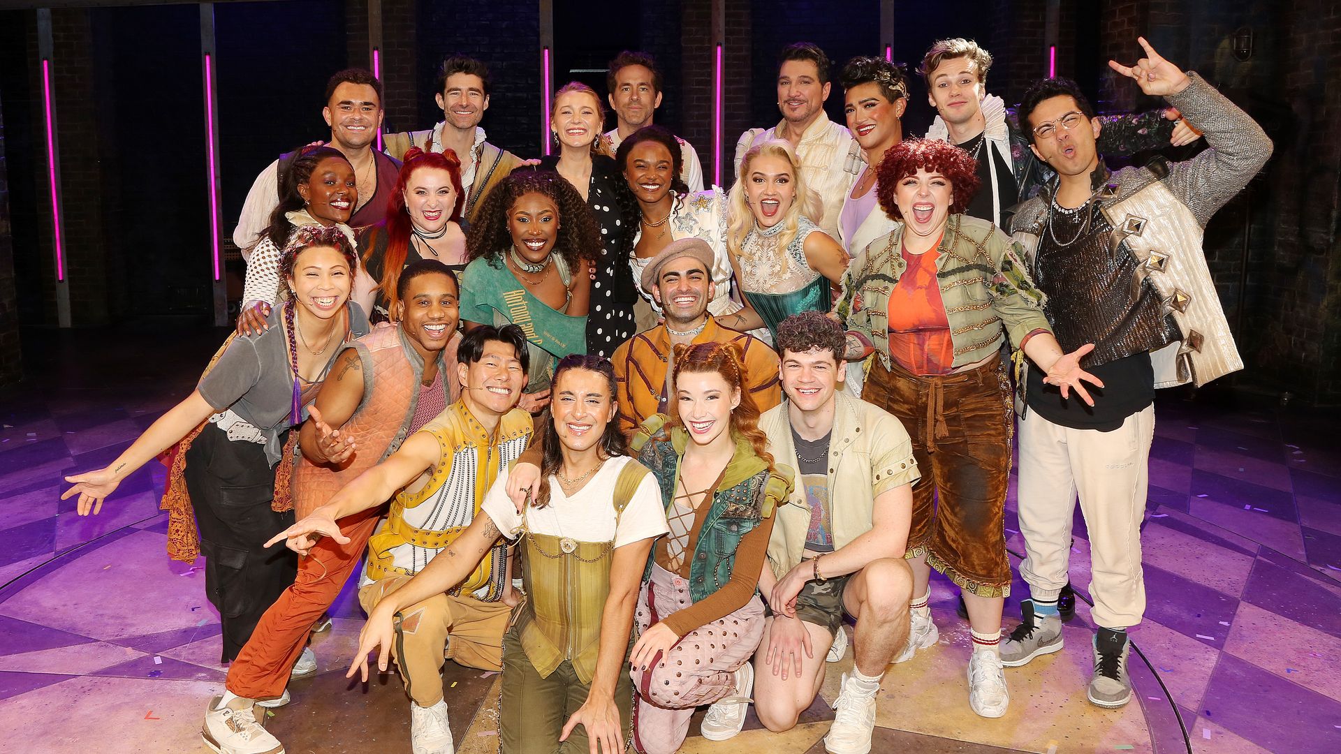 Ryan Reynolds and Blake Lively pose with the cast backstage at the hit Max Martin Musical "& Juliet" on Broadway at The Stephen Sondheim Theatre on October 23, 2024 in New York City. Blake Lively surprised Ryan Reyonalds on his 43rd Birthday with tickets to the hit Broadway Musical "& Juliet" and brought all 3 kids (not pictured) The cast sang "Happy Birthday" to Ryan and they posed for photos with the cast & crew