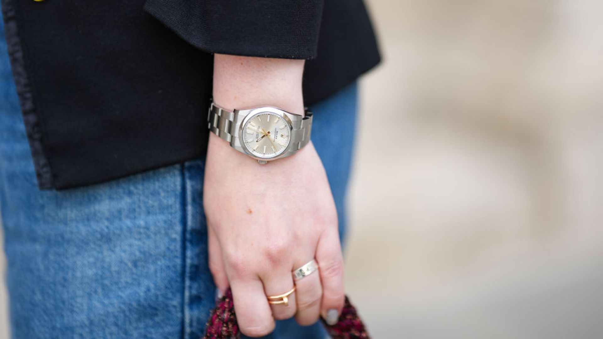 Iana Rad wears a Rolex Oyster Perpetual silver watch