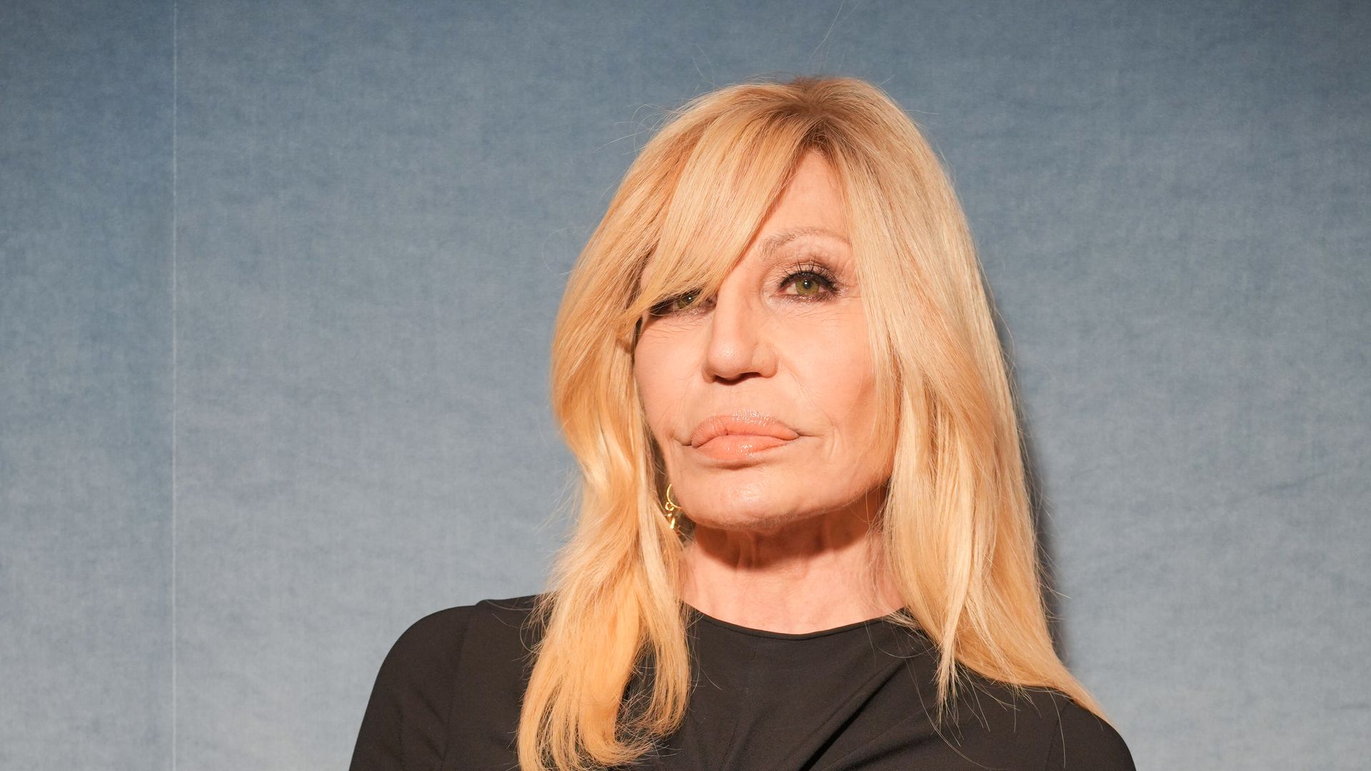 Donatella Versace wearing black at the Dior Homme show as part of Paris Men's Fashion Week on June 27, 2025 in Paris, France.