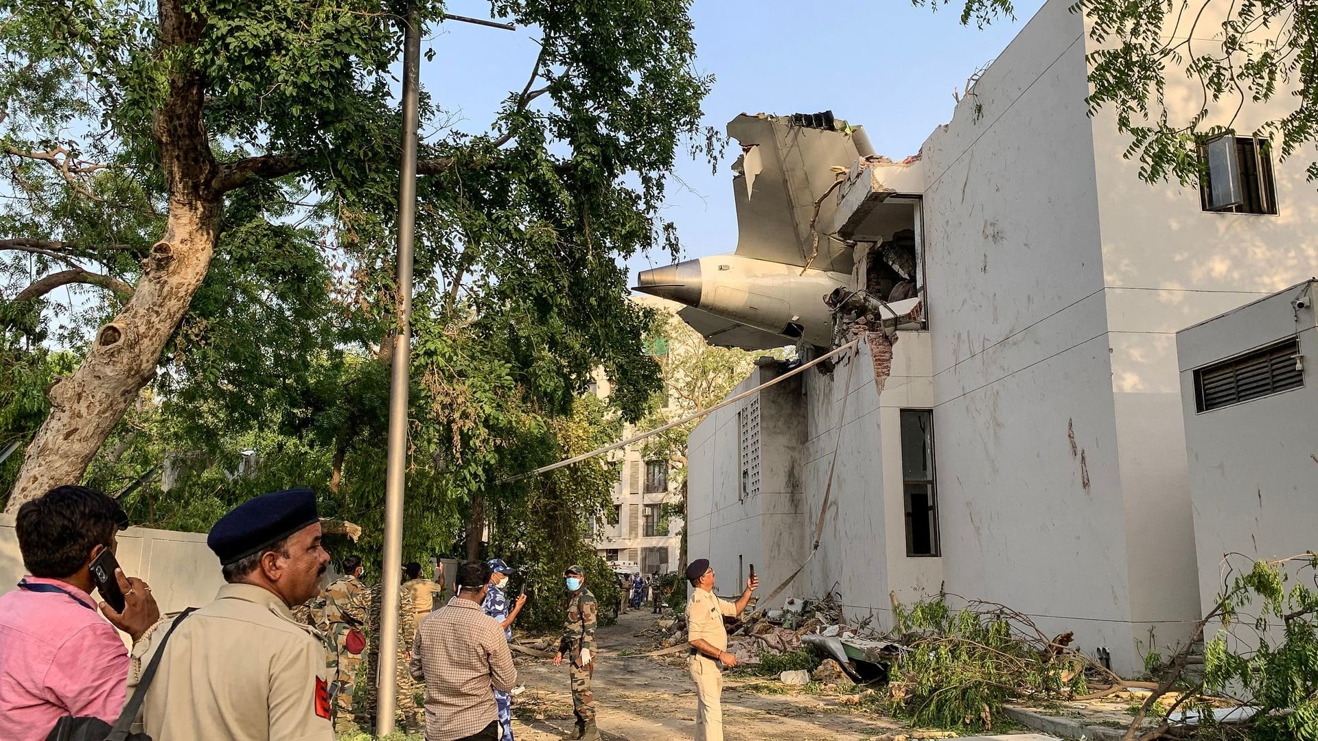 TOPSHOT - The back of Air India flight 171 is pictured at the site after it crashed in a residential area near the airport in Ahmedabad on June 12, 2025. A London-bound passenger plane crashed in the Indian city of Ahmedabad on June 12 and all 242 people on board were believed killed, with the jet smashing into buildings housing doctors and their families. (Photo by Sam PANTHAKY / AFP) (Photo by SAM PANTHAKY/AFP via Getty Images)          